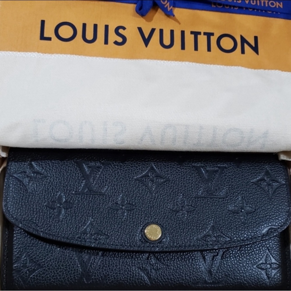 Sold 
LOUIS VUITTON EMILIE EMPREINTE LEATHER WALLET